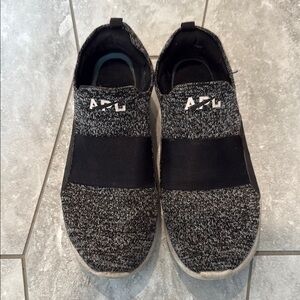 Women’s APL Black and Gray Athletic Slip-On Shoes